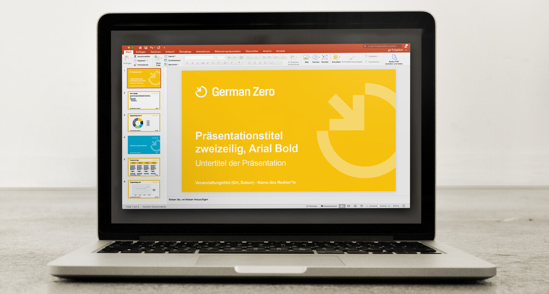 A PowerPoint presentation is shown on a screen. 