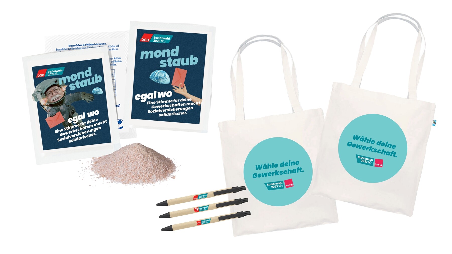 Ansicht verschiedener Giveaway-Artikel wie bedruckter Stoffbeutel, Kugelschreiber und Brausepulver mit dem Slogan „Mondstaub“.