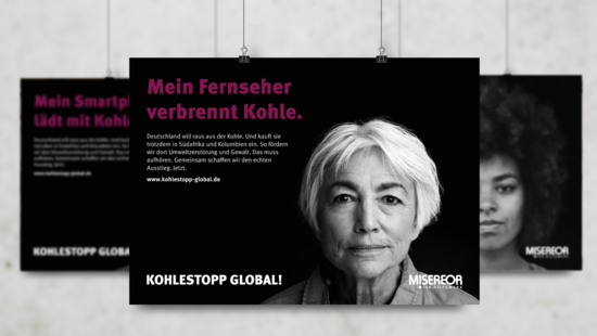 A campaign poster shows the face of a woman looking straight ahead.